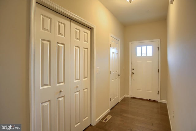 doorway to outside with dark hardwood / wood-style floors