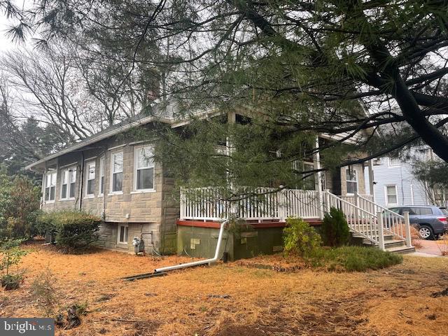 view of side of property with a deck