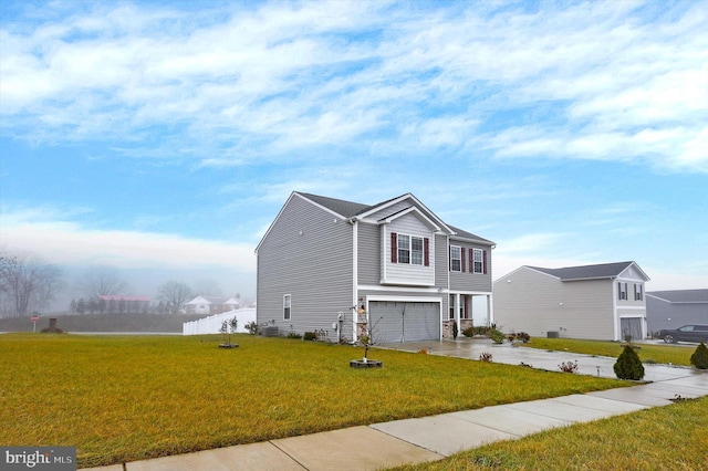 view of front of house with a front lawn and a garage