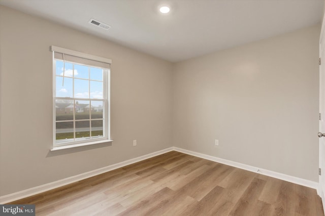 spare room with light hardwood / wood-style flooring