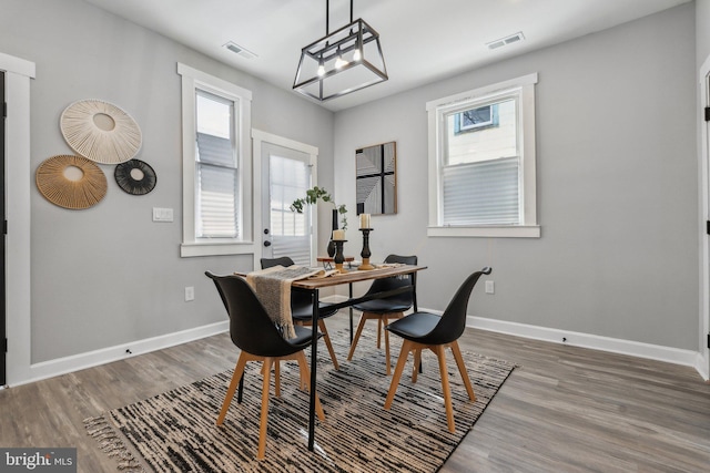 dining area featuring wood-type flooring