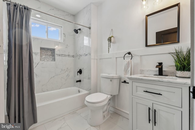 full bathroom featuring shower / bath combo with shower curtain, vanity, and toilet