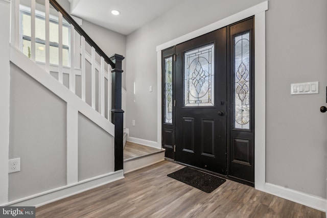 foyer entrance with hardwood / wood-style floors