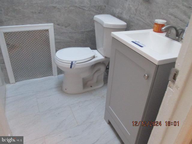 bathroom with vanity and toilet