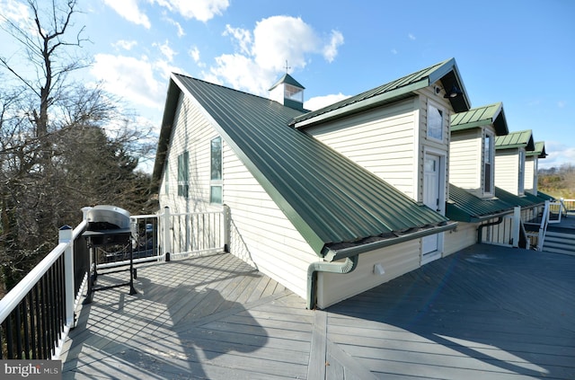 view of property exterior featuring a deck