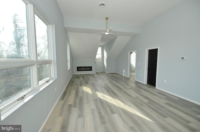 bonus room with light hardwood / wood-style flooring, ceiling fan, and lofted ceiling