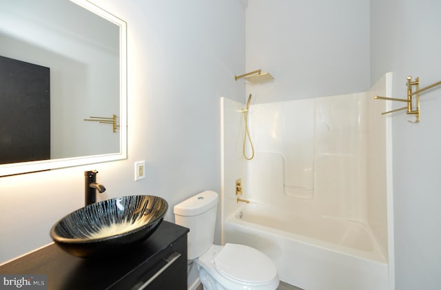 full bathroom featuring vanity,  shower combination, and toilet