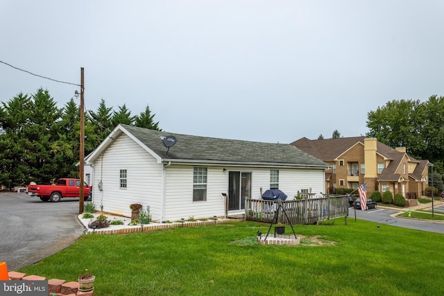 ranch-style house with a front lawn