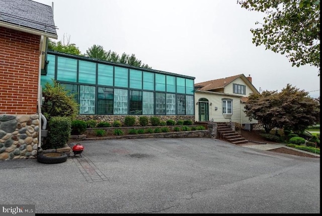 view of building exterior with cooling unit