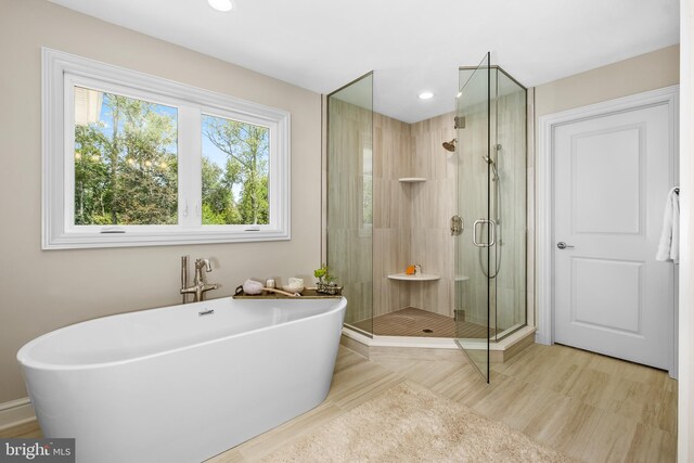 bathroom featuring plus walk in shower