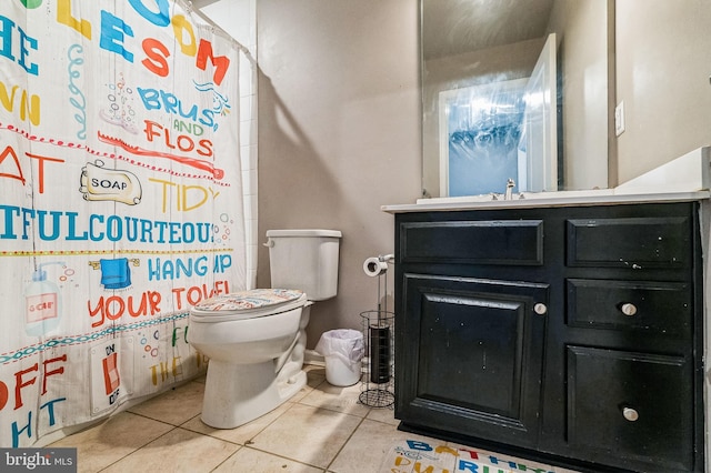 bathroom with tile patterned floors, vanity, and toilet