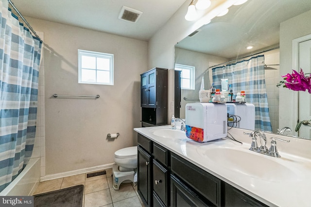 full bathroom with tile patterned flooring, vanity, toilet, and shower / tub combo with curtain