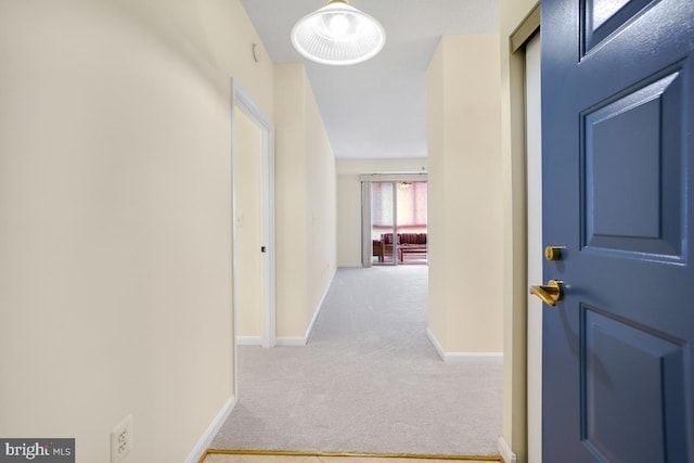 hall featuring carpet