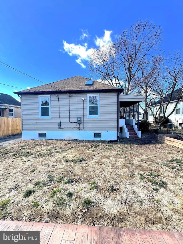 back of property featuring crawl space, fence, and a patio