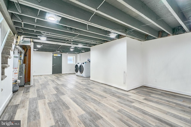 basement featuring hardwood / wood-style floors and washer and clothes dryer