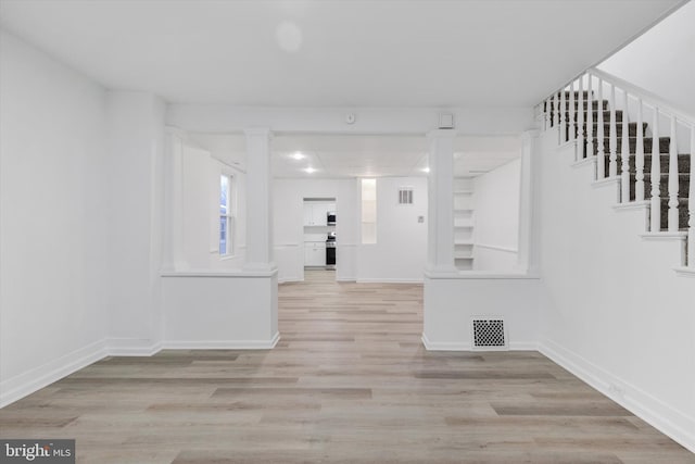 corridor with light wood-type flooring