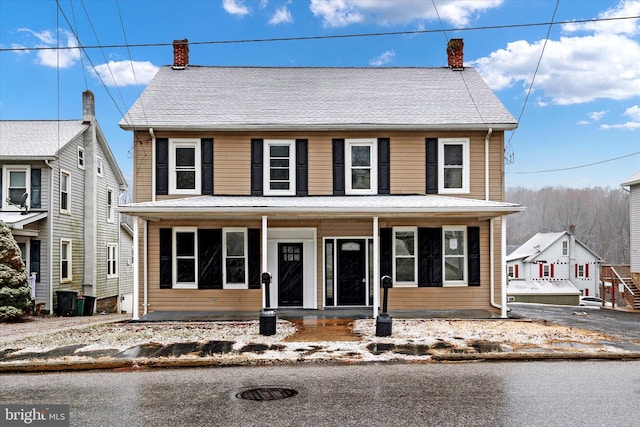 view of front of property featuring covered porch