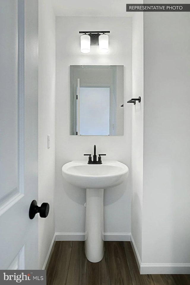 bathroom with wood-type flooring