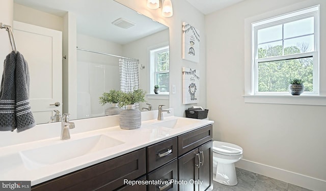 bathroom featuring a shower with curtain, vanity, toilet, and tile patterned flooring