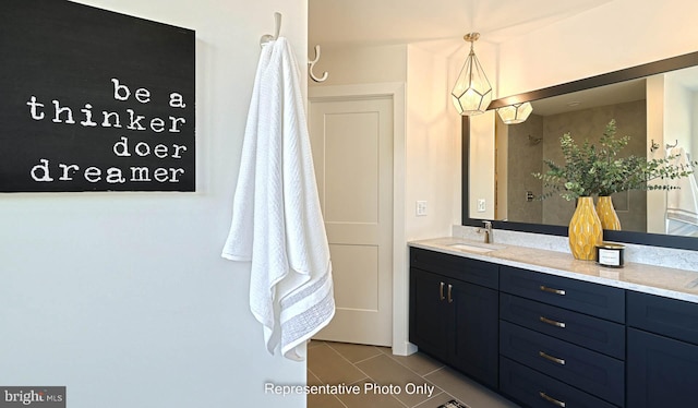 bathroom featuring tile patterned flooring and vanity