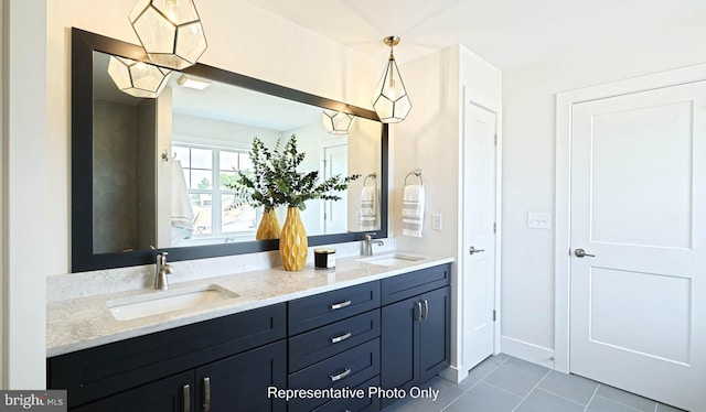 bathroom with tile patterned flooring and vanity