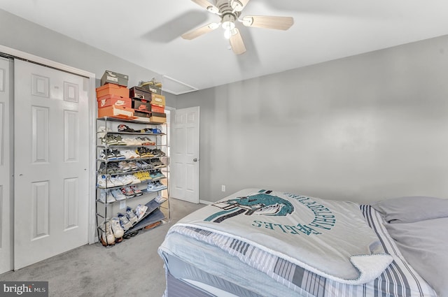 carpeted bedroom featuring ceiling fan and a closet