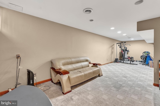 workout room featuring light colored carpet