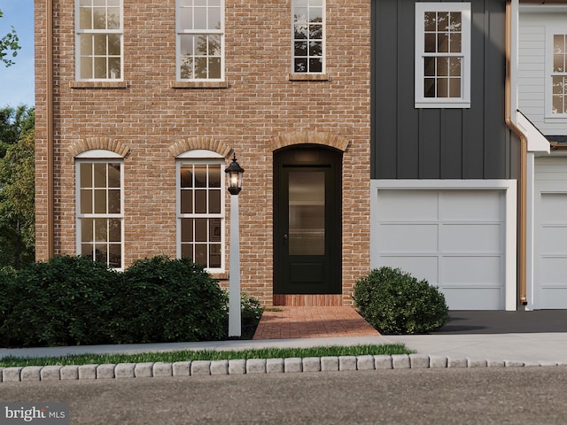 view of exterior entry with a garage