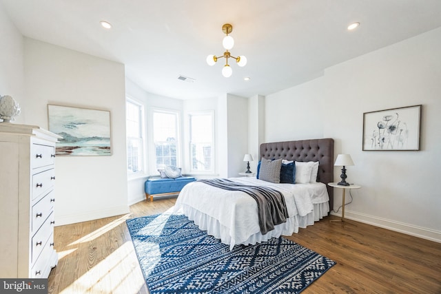 bedroom with hardwood / wood-style floors