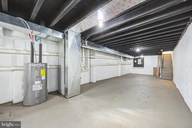 basement featuring electric water heater and electric panel