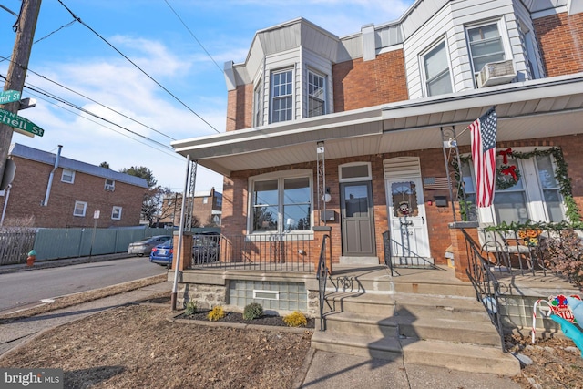 view of property featuring covered porch