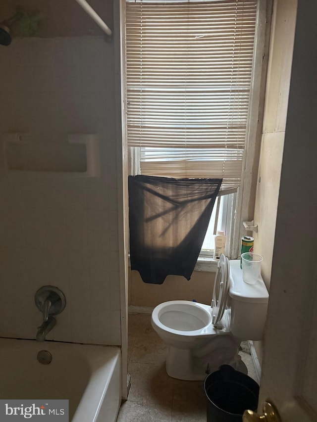 bathroom with tile patterned floors,  shower combination, and toilet