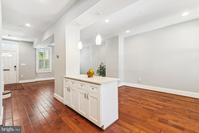 931 Farragut St NW, Washington, DC 20011 - kitchen with baseboards, dark wood-style flooring, white cabinets, and hanging light fixtures