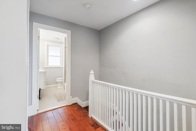 931 Farragut St NW, Washington, DC 20011 - hallway featuring wood-type flooring, baseboards, and an upstairs landing