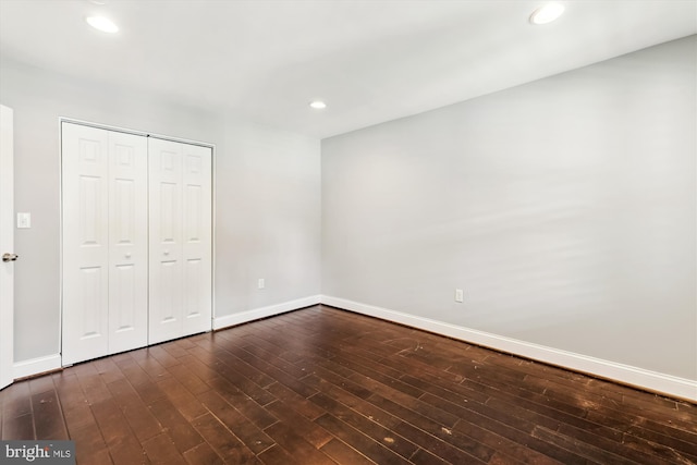 931 Farragut St NW, Washington, DC 20011 - unfurnished bedroom featuring recessed lighting, baseboards, dark wood-style floors, and a closet