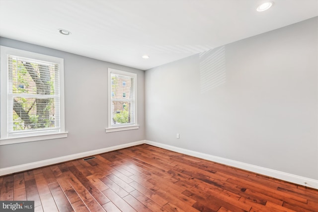 931 Farragut St NW, Washington, DC 20011 - empty room featuring baseboards, visible vents, wood-type flooring, and a wealth of natural light