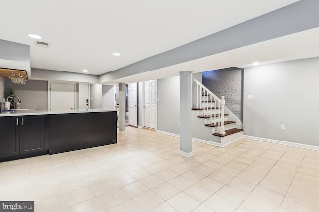 931 Farragut St NW, Washington, DC 20011 - kitchen with light countertops, dark cabinetry, recessed lighting, baseboards, and visible vents