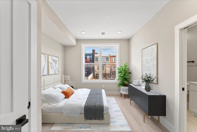 bedroom with light wood-type flooring