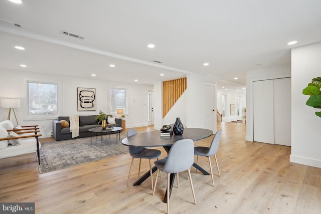 dining space featuring light hardwood / wood-style floors