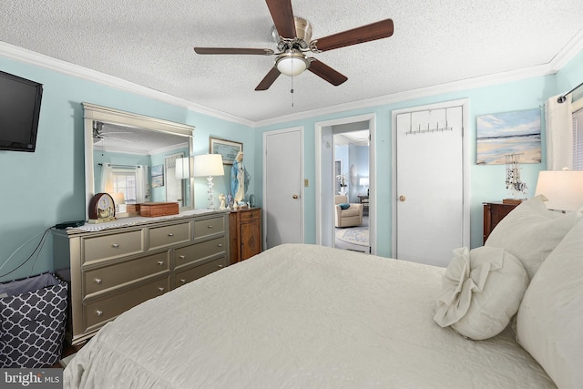 bedroom with ceiling fan, a textured ceiling, and ornamental molding