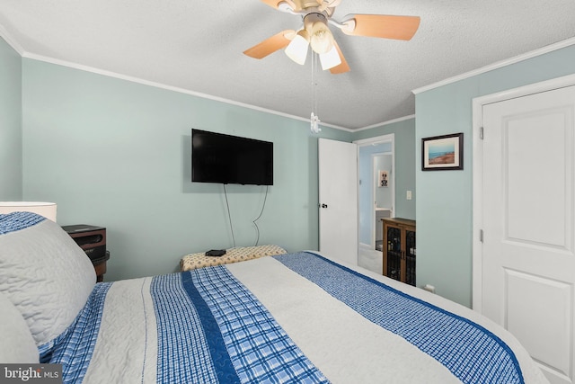 bedroom featuring a textured ceiling, ceiling fan, and crown molding