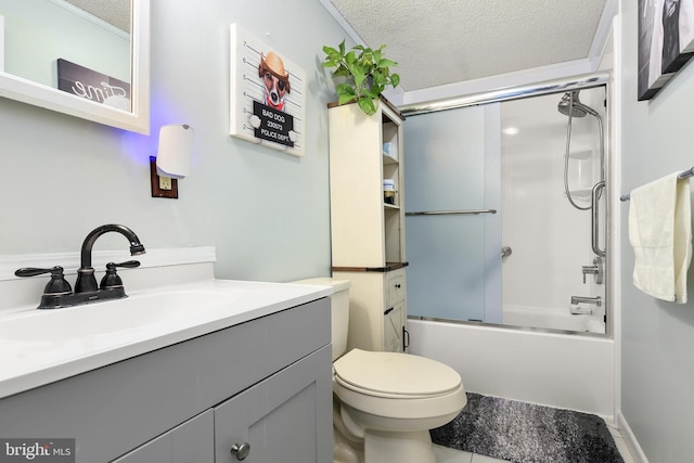 full bathroom featuring toilet, vanity, a textured ceiling, and combined bath / shower with glass door