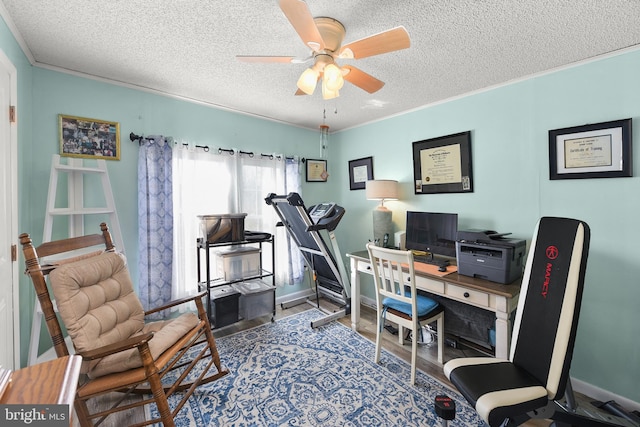 office featuring ceiling fan, wood-type flooring, a textured ceiling, and ornamental molding