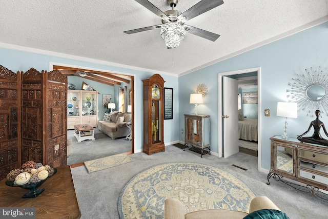 interior space with a textured ceiling and vaulted ceiling