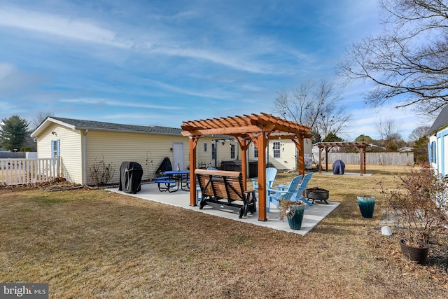 back of property featuring a pergola, a yard, and a patio