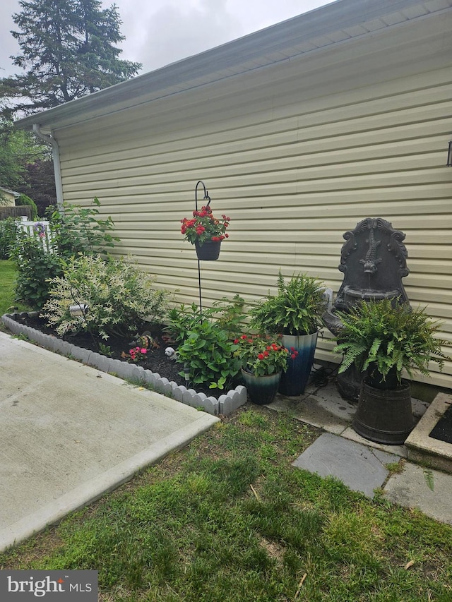 view of side of property featuring a patio area