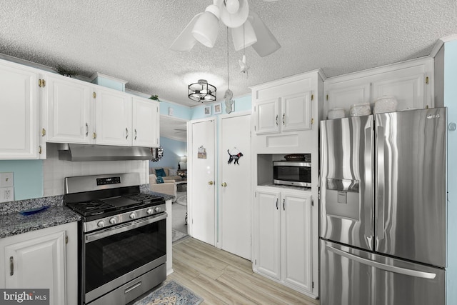 kitchen featuring ceiling fan, white cabinetry, and appliances with stainless steel finishes