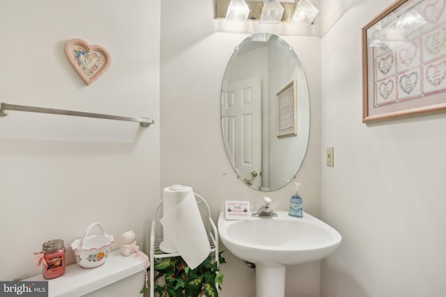 bathroom with sink and toilet