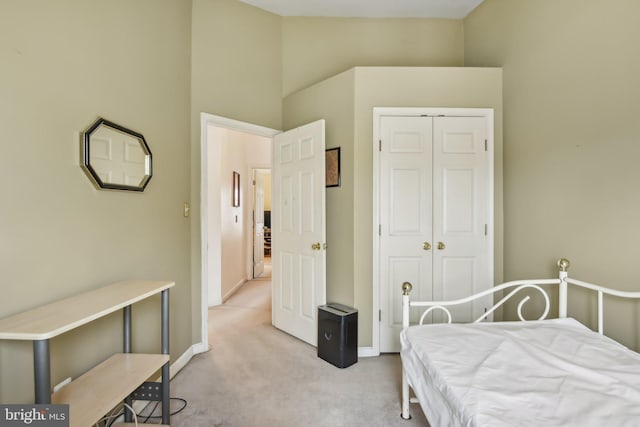 carpeted bedroom with a closet