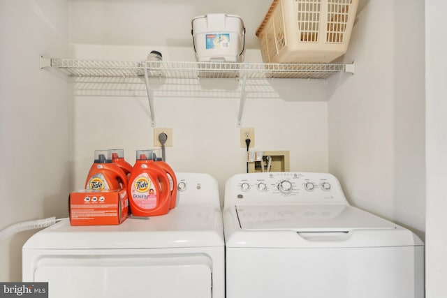 laundry area with washing machine and clothes dryer